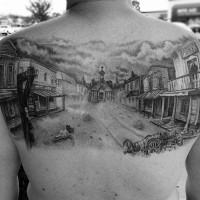 3D like big black and white old western town tattoo on upper back