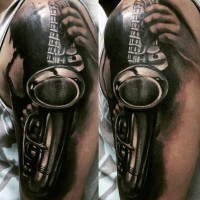 3D like big black and white sax tattoo on arm