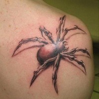 3D like big black and white scary spider tattoo on shoulder