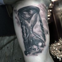 3D like big black ink mystical sand clock tattoo on arm