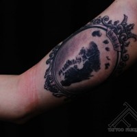 3D like black and white mystical portrait tattoo on arm