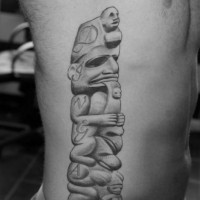 3D like black and white mystical tribal statue tattoo on side