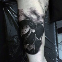 3D like black and white skull with old clock tattoo on arm