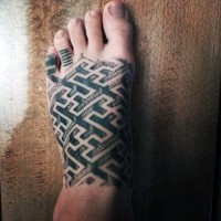 3D like black ink labyrinth like tattoo on foot