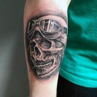 3D like black ink old riders skull in helmet tattoo on arm