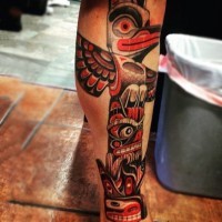 3D like colored big tribal statue tattoo on leg