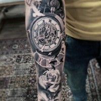 3D like gorgeous antic old mechanic clock with flower tattoo on arm