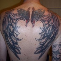 3D like interesting painted and detailed colored big wings tattoo on upper back