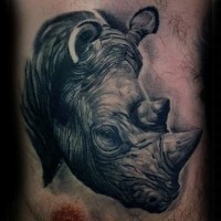 3D like massive black ink very detailed rhino head tattoo on chest