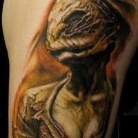 3D like natural looking colored on shoulder tattoo of colored horror nurse