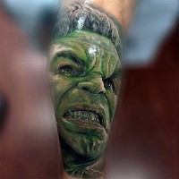 3D like painted detailed looking colored leg tattoo of Hulk face