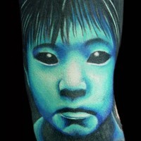 3D like very cool painted and colored creepy horror girl tattoo on arm