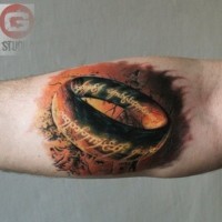 3D like very detailed colored forearm tattoo of Saurons ring