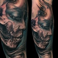 3D like very detailed colored forearm tattoo of demonic woman portrait