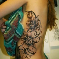 3D like very detailed various flowers tattoo on chest