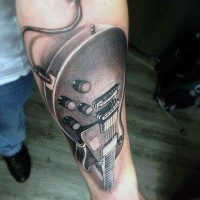 3D like very realistic looking modern guitar tattoo on arm