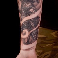 3D natural looking colored dark crow tattoo on forearm area