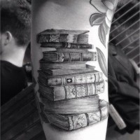 3D realistic detailed big antic books tattoo on arm