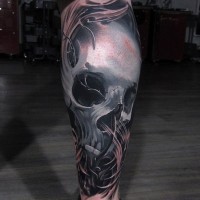 3D realistic painted big colored skull in fog tattoo on leg