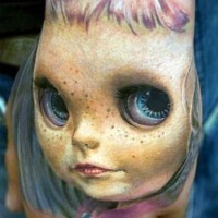 3D realistic very detailed creepy doll tattoo on hand