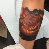 3D realistic very detailed Halloween pumpkin tattoo on arm