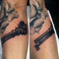3D realistic vintage key tattoo on arm