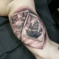 3D style black and gray colored vintage pictures tattoo on biceps