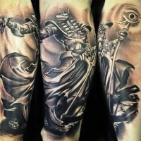 3D style black and white detailed forearm tattoo of Anubis God