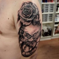 3D style black and white old clock and skull tattoo on shoulder stylized with rose