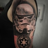 3D style black and white shoulder tattoo of Storm troopers helmet with emblem