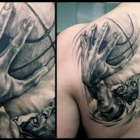 3D style black and white shoulder tattoo of basketball player