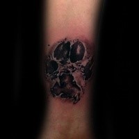 3D style colored forearm tattoo of big animal paw print