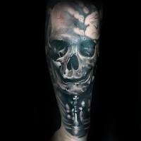 3D style colored forearm tattoo of human skull with chess figures