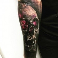 3D style colored forearm tattoo of magical skull
