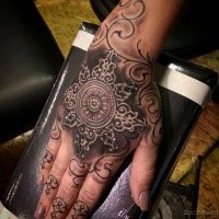 3D style colored hand tattoo of ornamental star