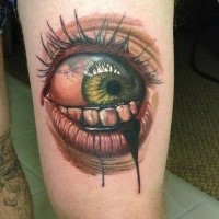 3D style colored horror style thigh tattoo of woman eye with bloody teeth