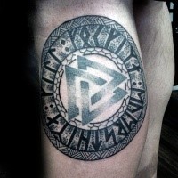 3D style colored leg tattoo of ancient symbol with lettering