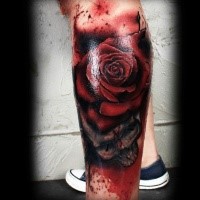3D style colored leg tattoo of red rose with skull