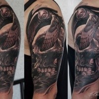 3D style colored shoulder tattoo of human skull and flying owl