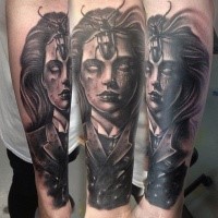 3D style creepy looking black ink forearm tattoo of creepy woman portrait and big bug