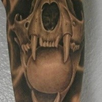 3D style creepy looking cat skull with orb tattoo on arm