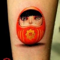 3D style cute looking arm tattoo of small daruma doll with symbol