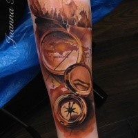 3D style detailed looking forearm tattoo of old compass and map