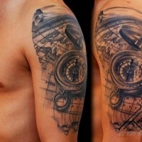 3D style gray washed style compass tattoo on shoulder combined with world map
