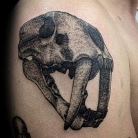 3D style interesting looking shoulder tattoo of ancient animal skull