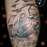 3D style memorial black and white leg tattoo of basketball with wings and lettering