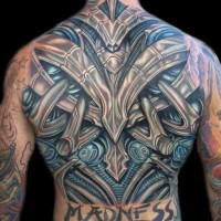 3D style multicolored funny looking colored alien armor tattoo on whole back with lettering