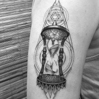 3D style mystical looking upper arm tattoo of sand clock with geometrical ornaments