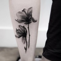 3D style natural looking black ink forearm tattoo of two flowers