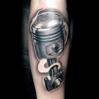 3D style natural looking colored car engine piston tattoo on leg